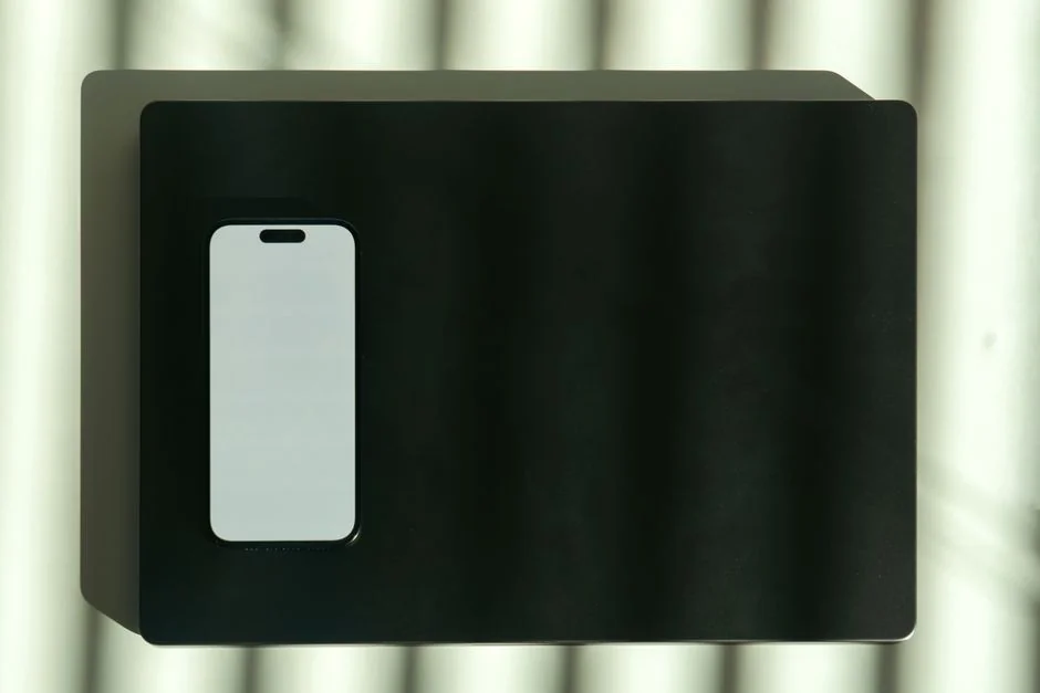 A man using a smartphone and credit card for an online payment, showcasing digital finance concepts.